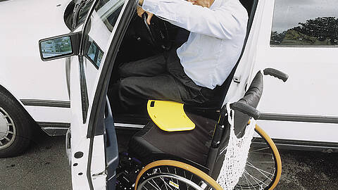 Glideboard in use, for safe seated patient transfer Glideboard in use, for safe seated patient transfer